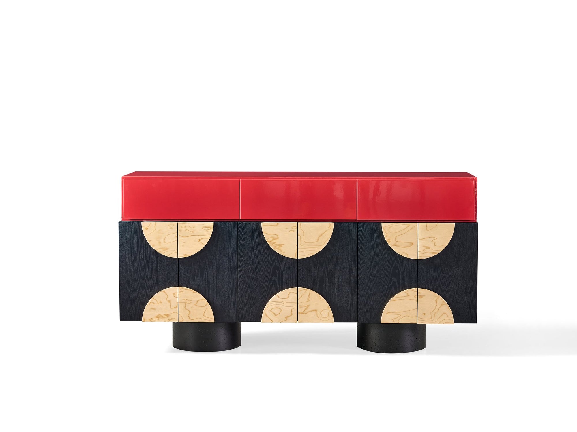 Modern console table with red top and black base with circular designs on a white background
