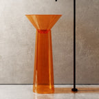 Orange glass vase on a neutral background