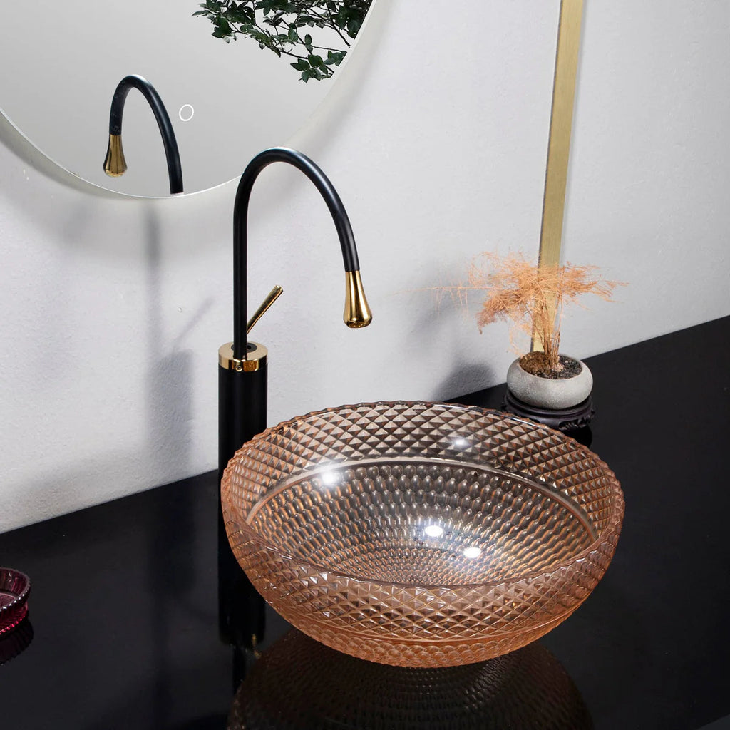 Glass bowl sink with black faucet in a bathroom setting