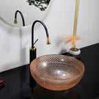 Glass bowl sink with black faucet in a bathroom setting